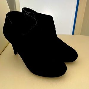 Black suede booted heels.